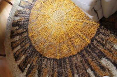 A circular woollen rug