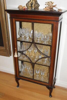 An Edwardian string inlaid mahogany display cabinet