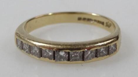 An 18ct gold half hoop eternity ring