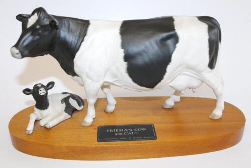 A Beswick Friesian cow and calf connoisseur model