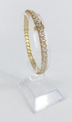 A 9ct gold and diamond tennis bracelet