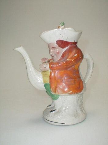 A Victorian Staffordshire Toby Teapot of The Squire taking snuff