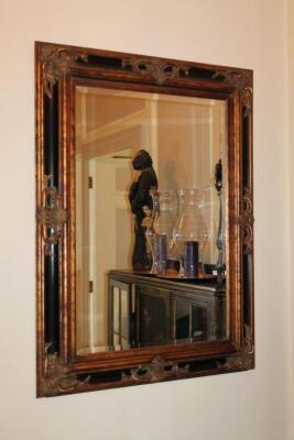 A reproduction wall mirror