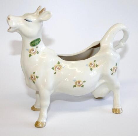 A Beswick cow shaped milk jug