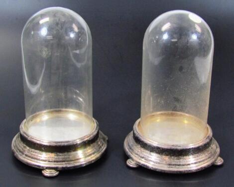 A pair of 20thC glazed domes