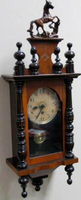 A early 20thC walnut stained Vienna wall clock