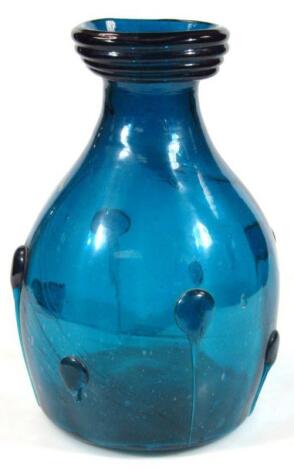 A modern large turquoise glass vase