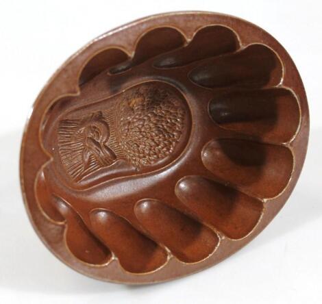 A late 19thC brown stoneware jelly mould