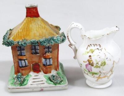 An early 20thC Staffordshire style money box cottage - 2