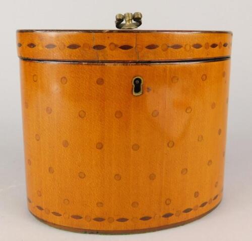 An early 19thC satinwood oval tea caddy