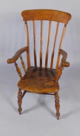 A 19thC elm and oak lath back kitchen chair