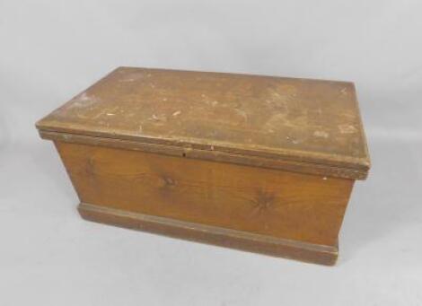 A pine blanket chest with a pair of cast iron carrying handles