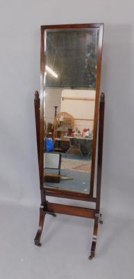 An Edwardian mahogany cheval mirror