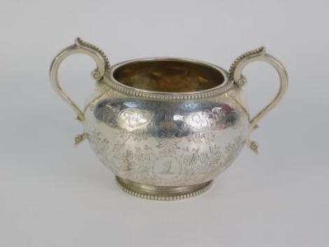 A Victorian silver twin handled sugar bowl