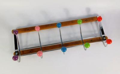 A Vintage atomic wall mounted coat rack