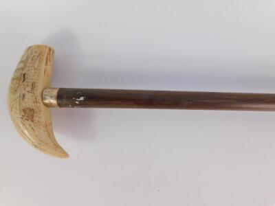 A bone scrimshaw walking stick 'The Whaler Eagle'