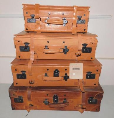 A set of four Giovanni tan leather graduated suitcases