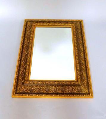 A rectangular gilt composite wall mirror