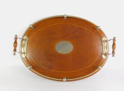 An Edwardian mahogany and plated twin handled oval galleried tray