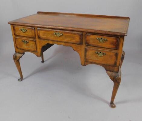 A George II style mahogany and cross banded dressing table