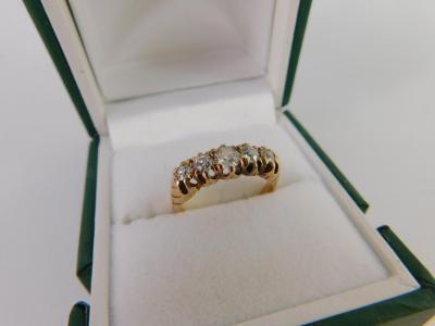 A diamond five stone ring