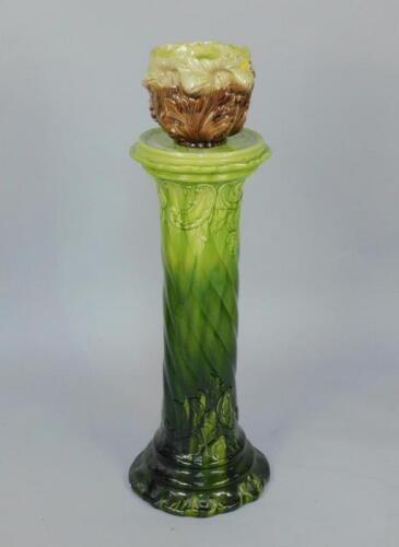 A Victorian green glazed spiral fluted jardiniere stand