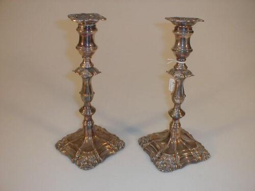 A pair of silver plated table candlesticks