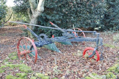 A 19thC cast iron Ransomes horse drawn plough.