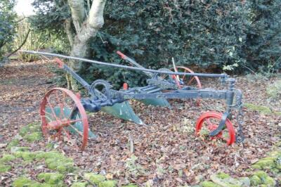 A 19thC cast iron Ransomes horse drawn plough.