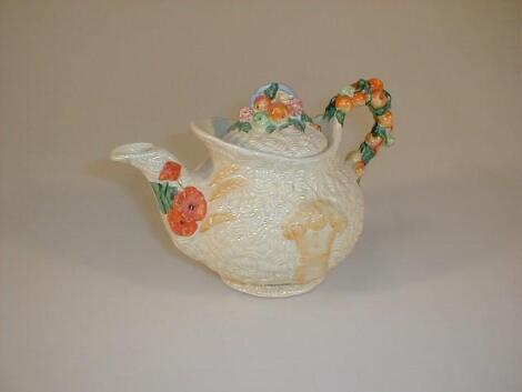 A Clarice Cliff Celtic harvest teapot with fruit cluster finial