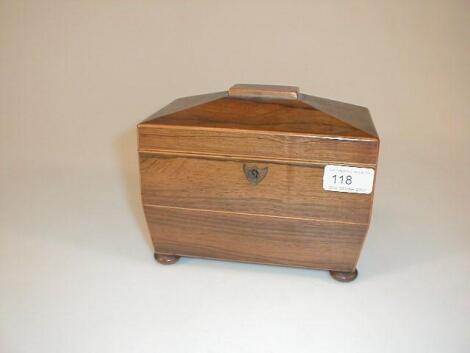 A Regency rosewood sarcophagus tea caddy with string decoration