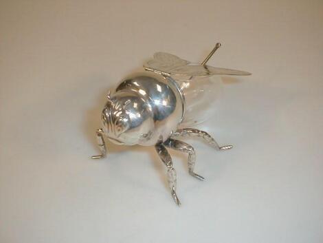 An electroplate and glass honey jar in the form of a bee