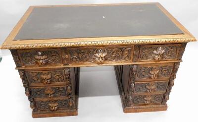 A Victorian oak pedestal desk