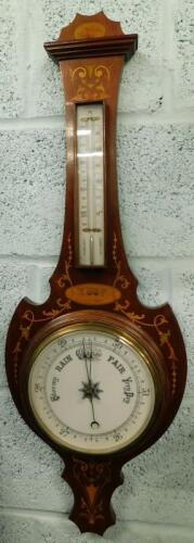 An Edwardian mahogany and marquetry wheel barometer