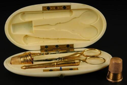 A late 19thC French yellow metal and ivory necessaire
