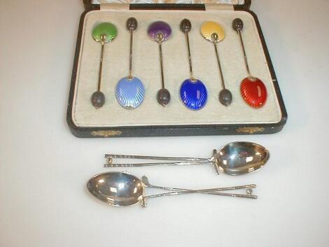 A cased set of six silver and enamel coffee bean spoon and a pair of silver golfing spoons