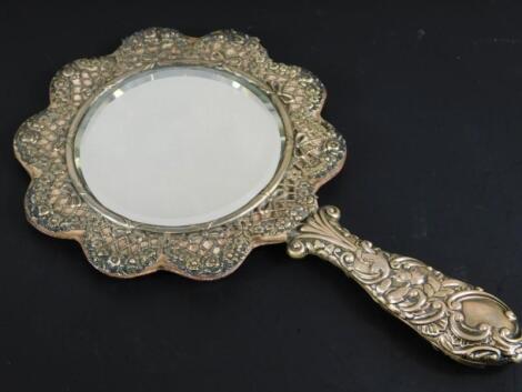 A late Victorian silver mounted hand mirror