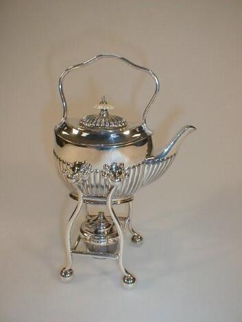 An electroplate part reeded bachelors spirit kettle on warming stand