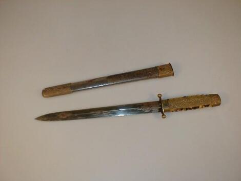 A short sword or dagger with faux tortoiseshell handle overlaid with embossed gilt metal