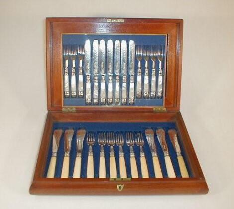 A mahogany cutlery box containing six pairs of bone handled fish cutlery