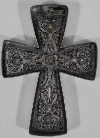 A filigree crucifix pendant