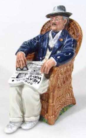 A Royal Doulton figure Taking Things Easy