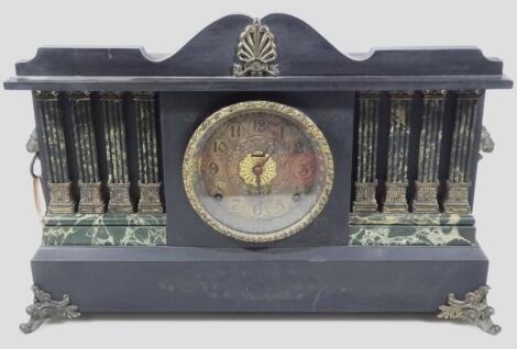 An early 20thC ebonised temporal mantel clock