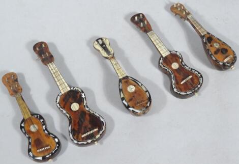 Five early 20thC mother of pearl tortoiseshell miniature musical instruments