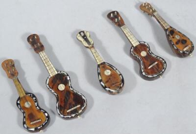 Five early 20thC mother of pearl tortoiseshell miniature musical instruments