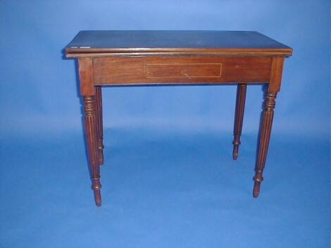 A 19thC tea table with rectangular folding top on part reeded legs