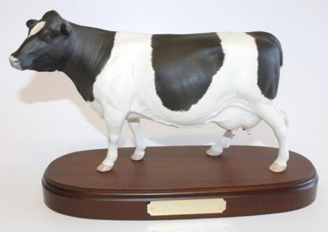 A Royal Doulton matt Friesian cow