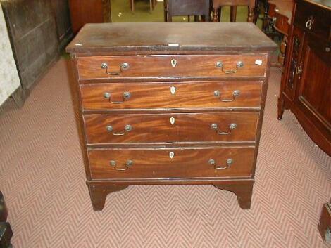 A George III mahogany chest of four drawers with brass swan necked handle and bracket feet