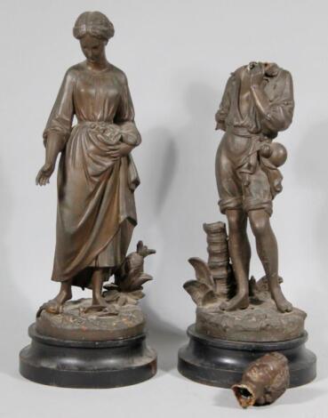 A pair of 19thC hollow cast bronze figures of a lady and gentleman