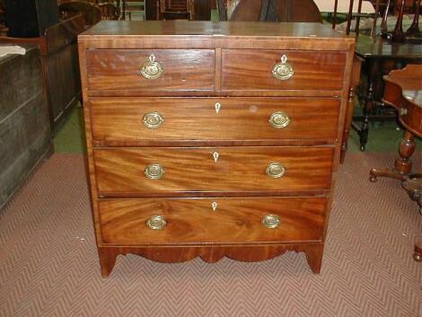 A Regency mahogany chest of two short and three long graduated drawers